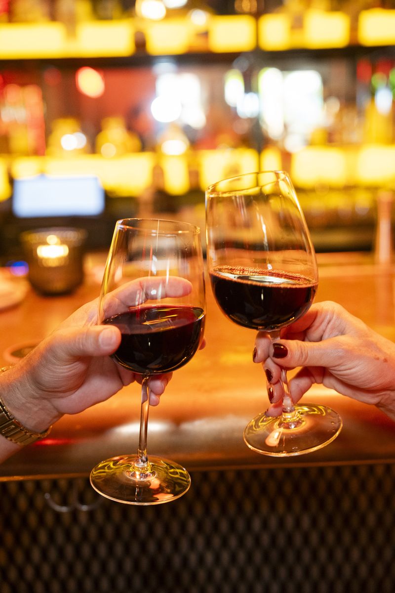 Wine night toast at the bar